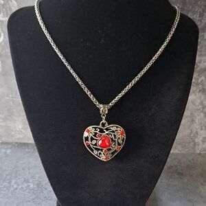 Elegant Silvertone Heart Pendant Necklace with Red Rhinestone Accents